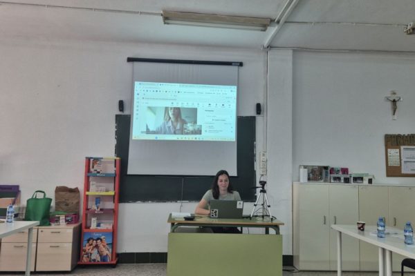 Bea visible behind the laptop, Viktoria (NASOR) on the screen behind her.